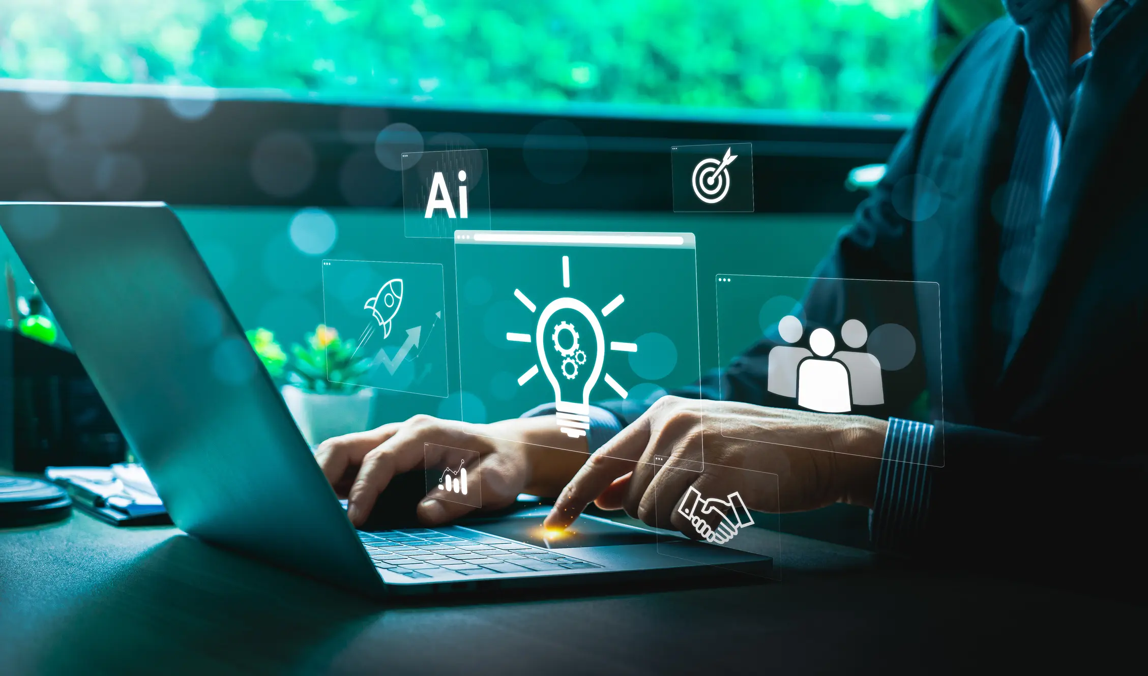 Person using laptop with AI icons displayed.